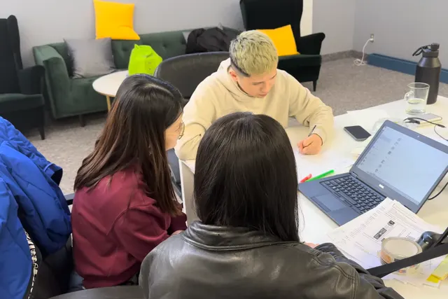 Aaron Lim working through a content plan with two team members at BB Media